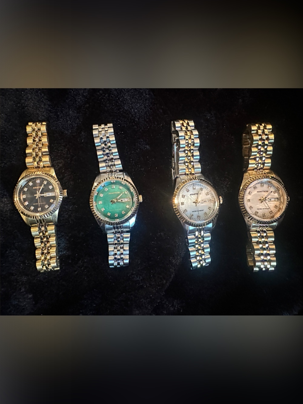 Set of Four Stainless Steel Women's Bracelet Watches with Colored Dials .